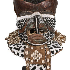 Object Royal Mask Ethnic group: KUBA, Bushoong Bwoom Country: DR Congo Material: Wood, Beads, Cauris, Copper Period: Mid 20th century Sold with stand: No Dimensions: 40x30x30 cm Weight: 2500 gram Condition: Good condition, used with some signs of wear