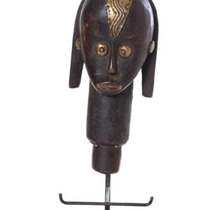 The wooden head is decorated with copper strips.