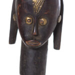 The wooden head is decorated with copper strips.