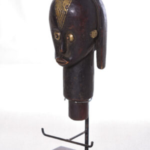 The wooden head is decorated with copper strips.