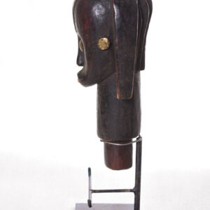 The wooden head is decorated with copper strips.