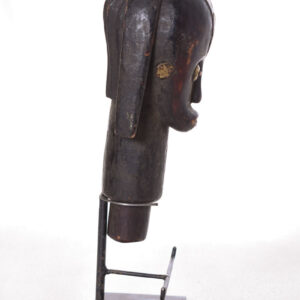 The wooden head is decorated with copper strips.