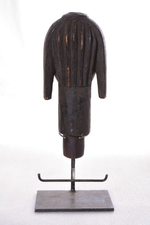 The wooden head is decorated with copper strips.